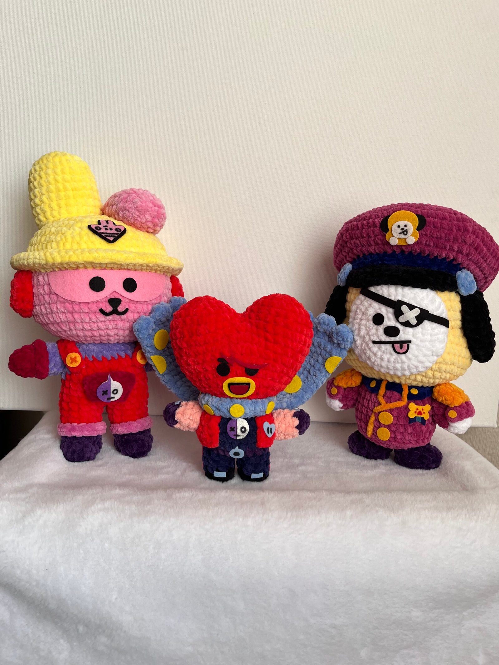 Handmade colorful trio amigurumi — bunny, heart, and pirate puppy